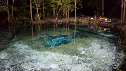 Nigth photo of the surface of the water od the Devils ear cavern in Ginnie Springs