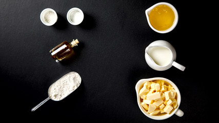 Ingredients for Baking Cake, Pie, Cake or Muffin. Preparation of the test on a black background.Top View.Copy space for Text.selective focus.