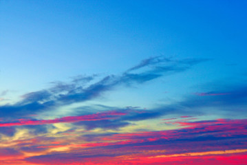 Multicolored clouds in the sky before sunrise.