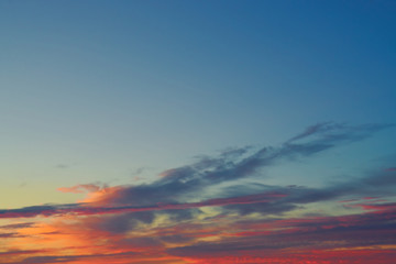 Multicolored clouds in the sky before sunrise.