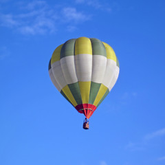 Fototapeta premium balloon with two passengers rises into the sky