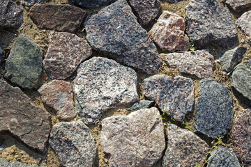 Paved hand-made track from different shapes stones