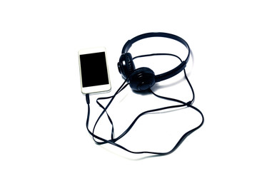 white mobile phone connected with headset on white background isolated