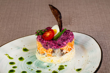 Russian traditional salad with herring