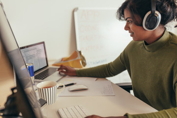 Female programmer working in office