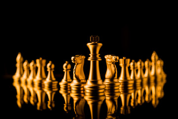 business strategy ideas concept golden chess competitive game dark color tone