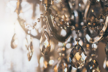abstract image background of blur bokeh and crystal chandelier light equipment filter tone color...