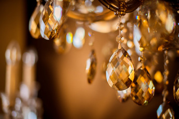 abstract image background of blur bokeh and crystal chandelier light equipment filter tone color...