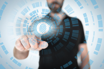 security concept with businessman touching translucent fingerprint sensor