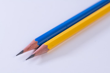 Several sharp new lead graphite pencils of various colors and patterns