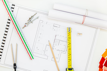 Interior designer table workplace with house plan