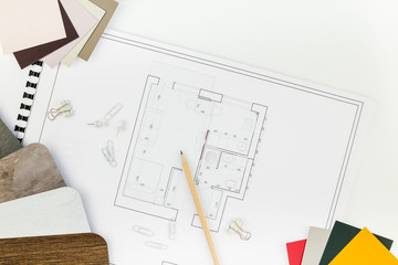 Interior designer table workplace with house plan