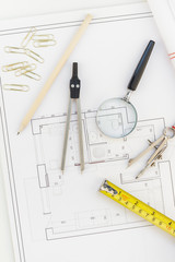 Interior designer table workplace with house plan