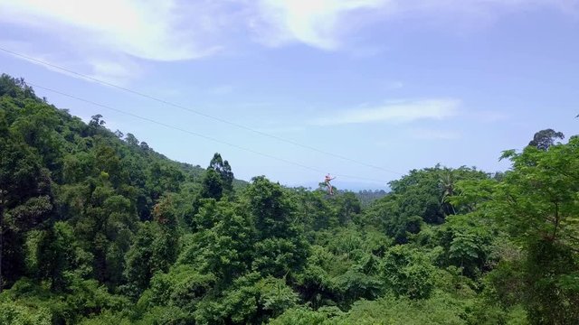 Aerial View of Tourists Riding on Zipline or Canopy Rope. Adrenaline Adventure on Vacation
