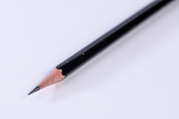 Single isolated black lead graphite pencil with a white background