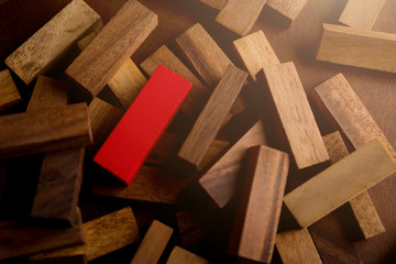 business leadership  ideas concept with red wood block stand out from other brown block