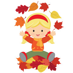 Cute girl sitting on a pile of leaves