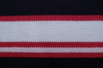 striped knitted fabric close-up black red white rift cloth