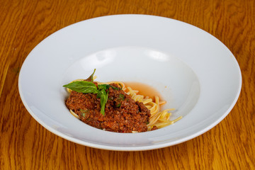 Pasta Bolognese with basil