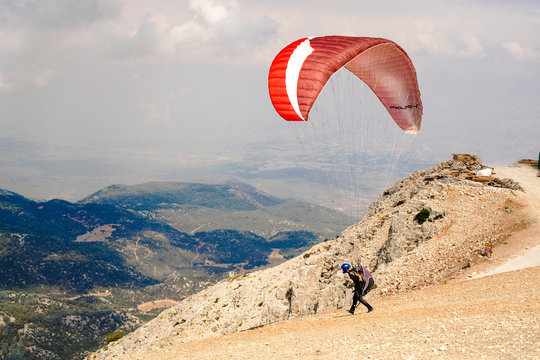 Fethiye, Mugla/Turkey- August 19 2018: Paragliders preparing the equipment on Babadag for the launching / Ready to fly.