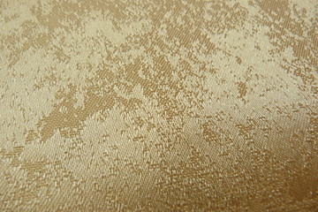 shiny golden fabric close-up of brocade organza