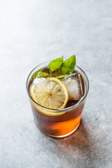 Cold Iced Tea Bergamot with Mint Leaves, Lemon and Ice.