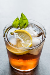 Cold Iced Tea Bergamot with Mint Leaves, Lemon and Ice.