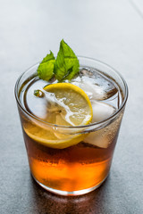 Cold Iced Tea Bergamot with Mint Leaves, Lemon and Ice.