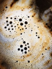 Fresh Americano coffee with foam close up  