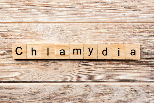 chlamydia word written on wood block. chlamydia text on table, concept