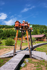 The territory of the arboretum, houses for birds. The Village Of Altai, Gorny Altai, Southern Siberia