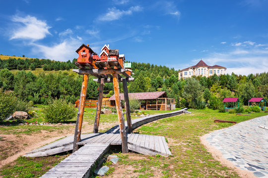 The territory of the arboretum, houses for birds. The Village Of Altai, Gorny Altai, Southern Siberia
