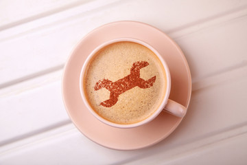 Cup of coffee with wrench on foam. I like coffee break. Repair service concept. Technical support