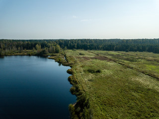 Obraz premium drone image. aerial view of rural area with fields and forest lake
