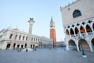 Saint Mark bell tower, National Marciana library and Doge palace view, nobody in the early morning in Venice, Italy