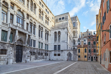 Venice, empty square or campo with ancient buildings in a sunny summer day in Italy