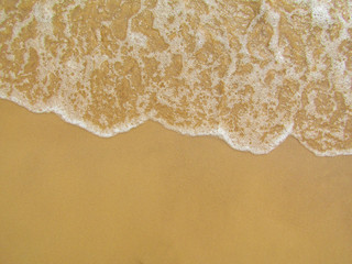 Wave of the sea on a sandy beach. Background