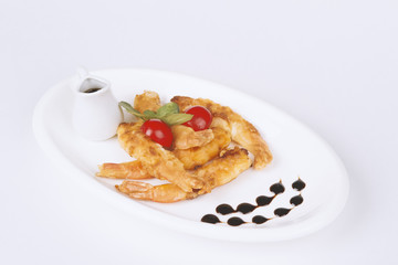 shrimp in breading in a white plate