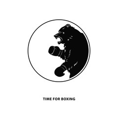 Black bear in Boxing gloves. Silhouette of a wild animal. Round emblem of a snarling beast for sport event. Art design. Vector illustration