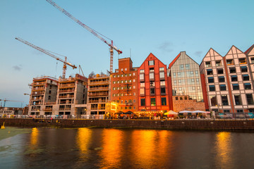 Olowianka island with building construction in Gdansk at sunset, Poland.