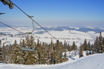 skiers on lift