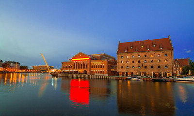 Gdansk, Poland - August 18, 2018: Gdansk (Danzig) at night with reflection in Motlawa river, Poland