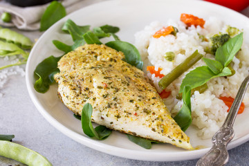 Healthy food: Roast chicken meat and Fried rice with vegetables, close-up. Diet menu.