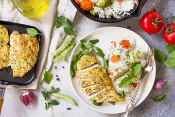 Healthy food: Roast chicken meat and Fried rice with vegetables. Diet menu. Top view flat lay background.