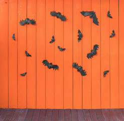 Halloween card, bats on an orange background