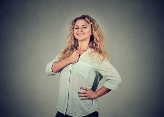 Self confident young woman looking proud of herself