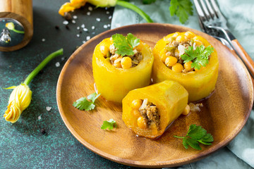 Healthy food: Baked Zucchini Stuffed - with chickpea and Meat on a stone or slate background. Diet menu.