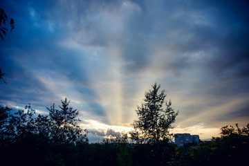 A unique natural phenomenon: sunset, the sun's rays illuminate the sky