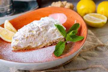 Close up view of beautiful elegant sweet dessert served on the plate. Beautiful decoration, restaurant dish, ready to eat. Tea time, cozy atmosphere.