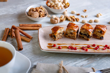 Close up view of beautiful elegant sweet dessert served on the plate. Beautiful decoration, restaurant dish, ready to eat. Tea time, cozy atmosphere.